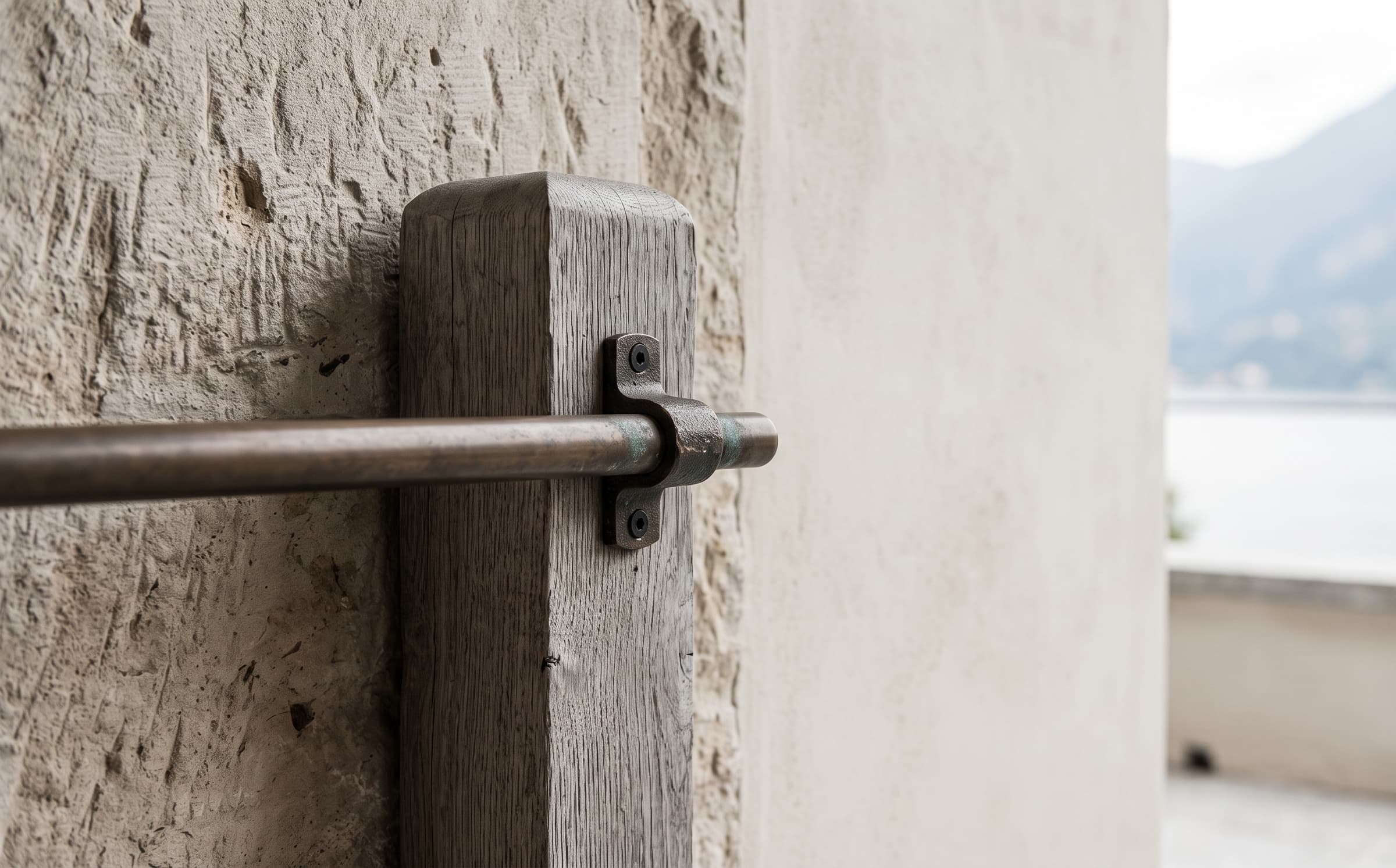 A limestone, oak and bronze material junction at Casa Lume