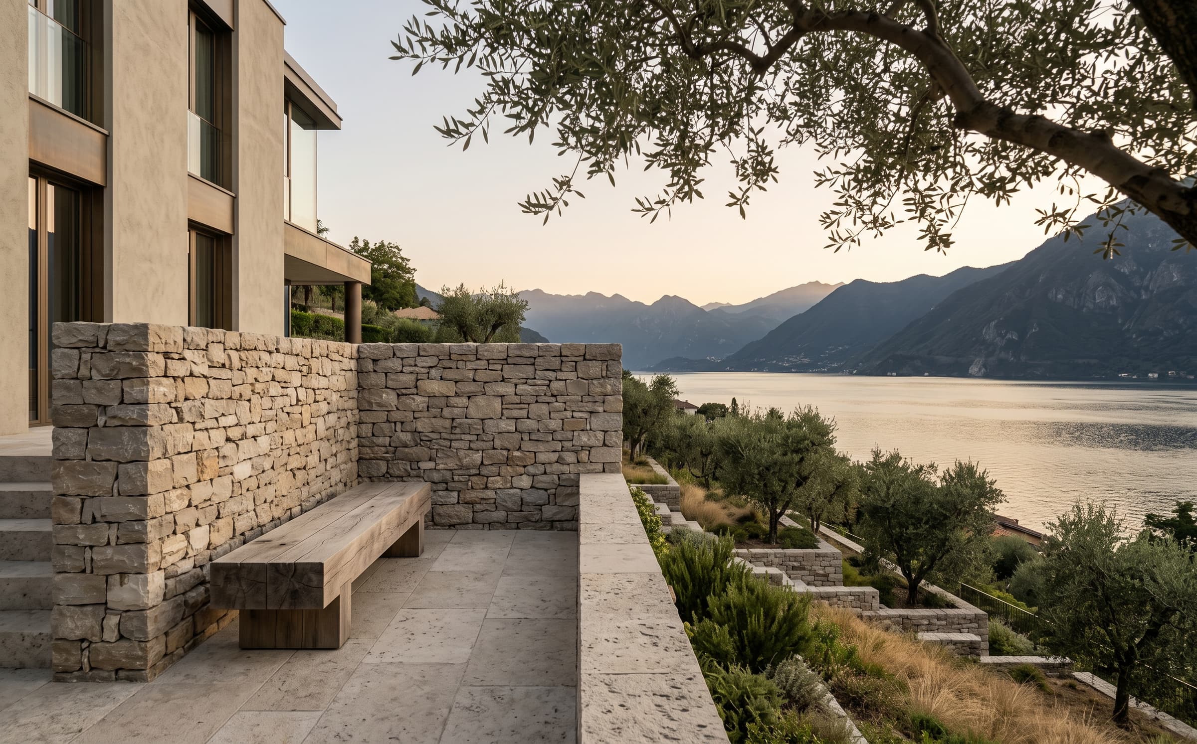 The hillside terrace of Casa Lume above Lake Como, in limestone and oak