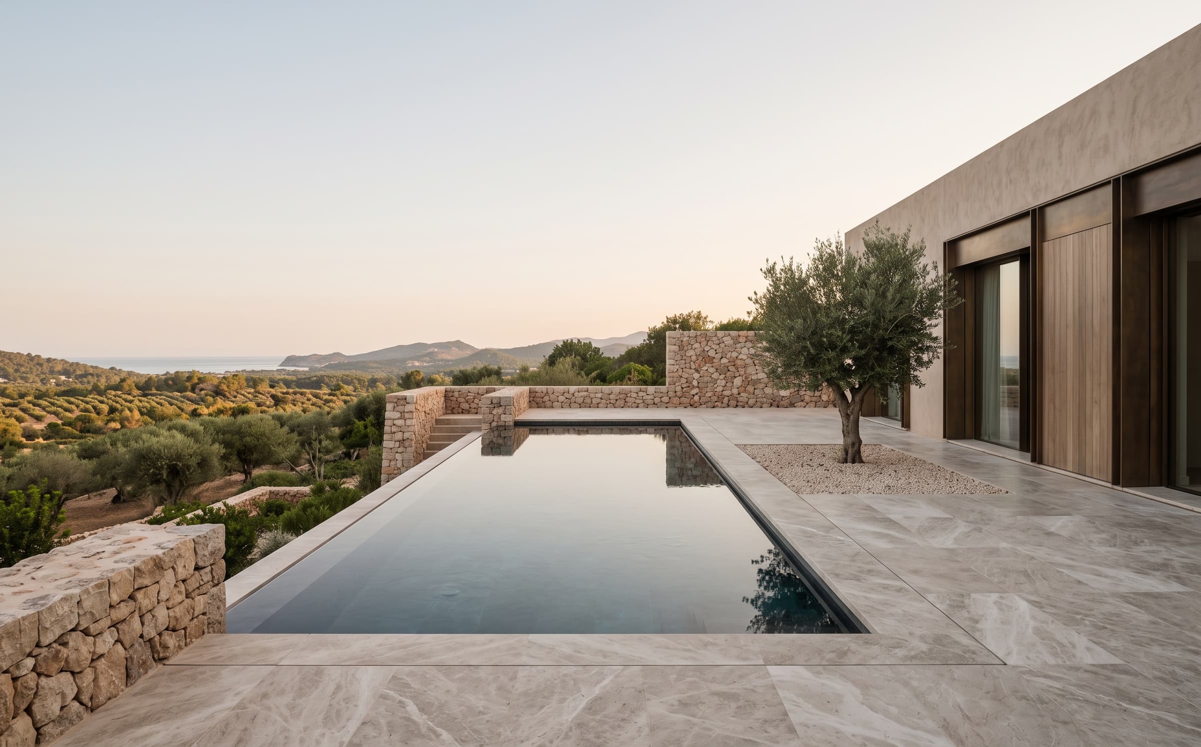 The terrace and pool of Marea House overlooking the Mallorcan landscape