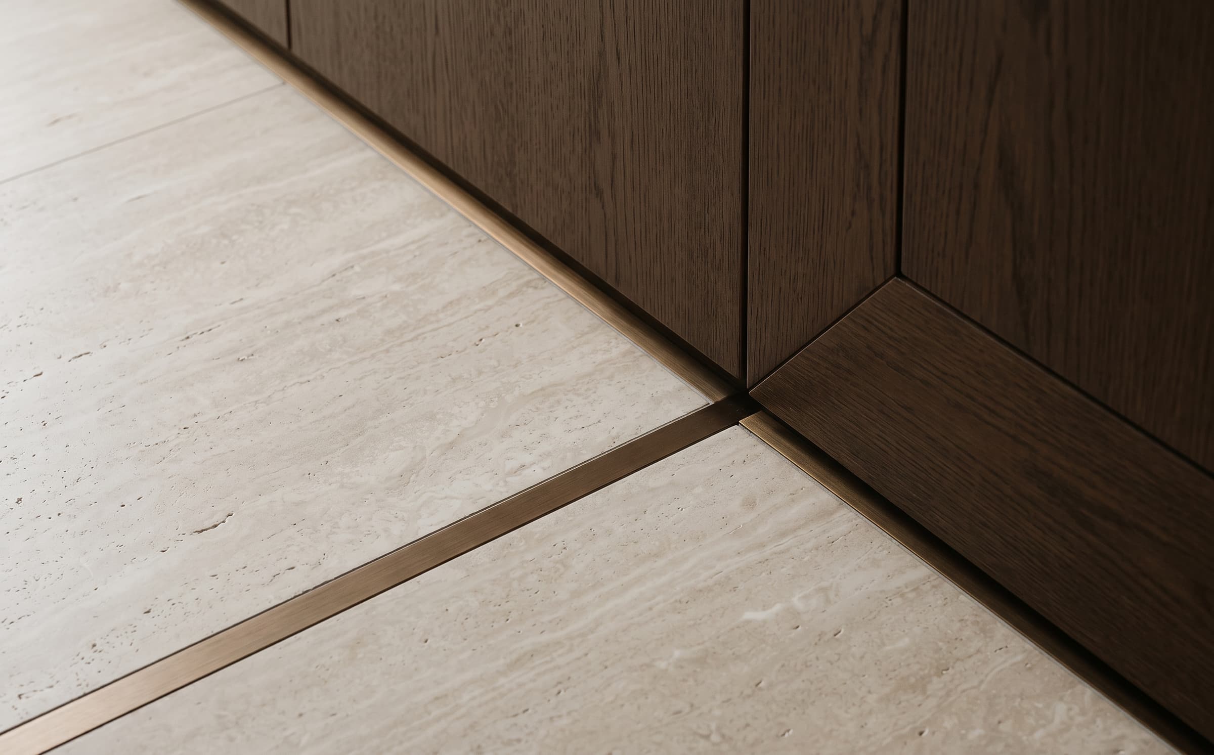 A travertine, oak and bronze junction inside the Skyline Residence